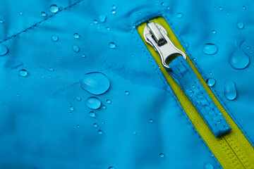 Light blue waterproof fabric with water drops as background, closeup