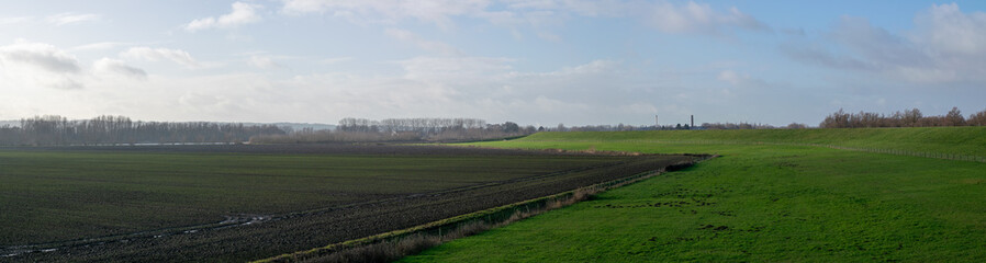 Fototapeta na wymiar A dyke in a Dutch polder landscape