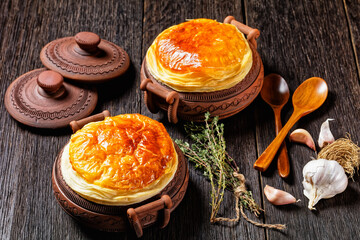 chicken pot pie in the rustic clay pots