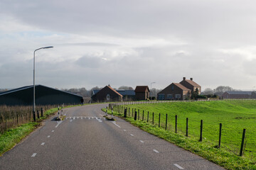 Fototapeta na wymiar Small Dutch farm next to polder