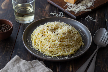 Roman pasta spaghetti with black pepper and cheese. Cacio e pepe. Recipes. Wine.