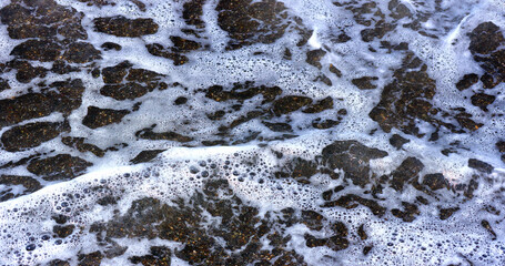 Stormy ocean wave on the coastline.