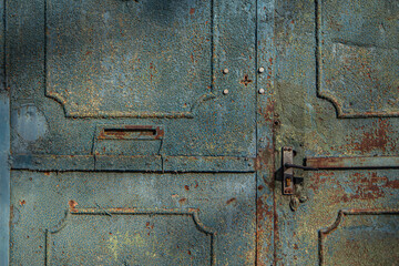 textured surface of a metal rusty door, yellow blue and rusty color, old painting of a vintage forged entrance gate, beautiful rust on metal, door handle, geometric shapes