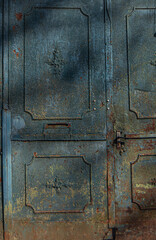 textured surface of a metal rusty door, yellow blue and rusty color, old painting of a vintage forged entrance gate, beautiful rust on metal, door handle, geometric shapes
