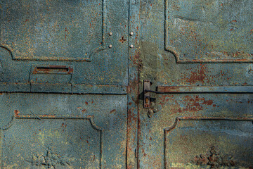 textured surface of a metal rusty door, yellow blue and rusty color, old painting of a vintage forged entrance gate, beautiful rust on metal, door handle, geometric shapes