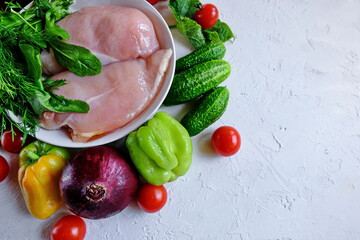  Ketogenic diet concept. Ketogenic Diet (or Keto Diet) on chalkboard, health conceptual. Healthy fresh low carbohydrates food; tomatoes,cauliflower, cucumbers, onions, chicken, sweet pepper.