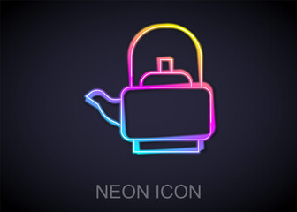 Fototapeta premium Glowing neon line Kettle with handle icon isolated on black background. Teapot icon. Vector.