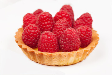 Pie basket with fresh raspberries. Isolated on a white background