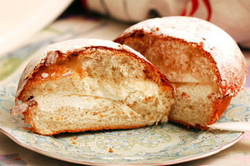 Fresh butter cake with cream cut in half