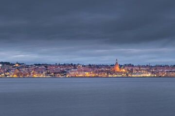 View of the center of Östersund just after sunset as seen from the shore of the island of Frösön