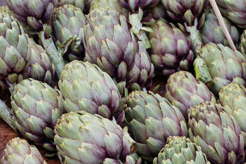 close up of artichokes at market
