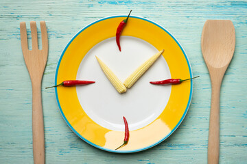 Food clock. Healthy food concept on blue or green background