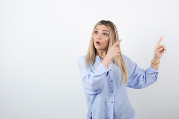 Image of young beautiful woman looking at something on white background