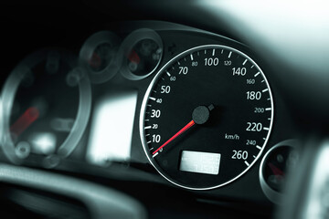 Luxury car speedometer close up. Speedometer arrows in dark colors.