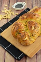 Fresh Slices of Homemade Baked Breaded Bread with Poppy Seeds and Cashew nuts