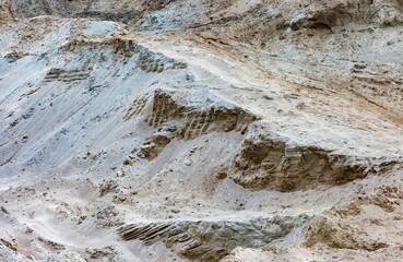 View of the mountain of gray-brown sand in autumn. Background