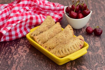 Homemade pasties hand pies with cherry filling
