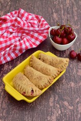 Homemade pasties hand pies with cherry filling
