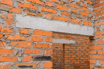 Closeup door monolithic concrete lintel unfinished building construction.