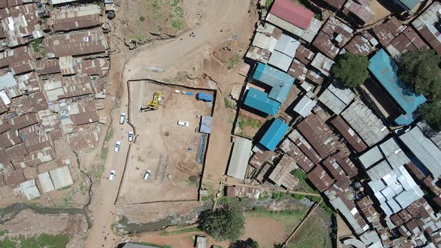 Drone bird view : Cars moving on the poor roads of the slums of kibera nairobi kenya.