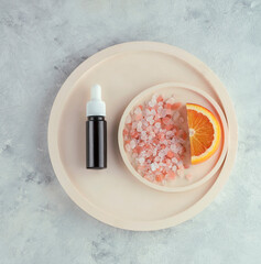 glass bottle with organic cosmetic serum or oil, spa cosmetics, self-care, top view