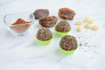 Chia seed dates almond cacao energy balls. White background
