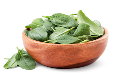 Spinach leaves in a wooden plate close-up on a white. Isolated
