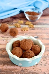 Homemade healthy vegan chocolate truffles with dates and walnuts