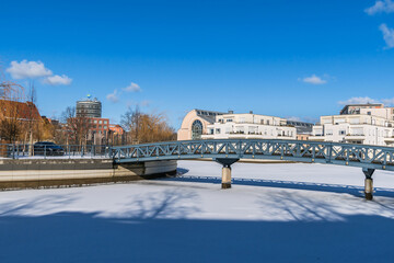 Frozen Harbor basin Tegeler Hafen with the footbridge in Berlin, Germany