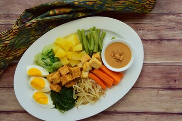 Traditional Indonesian Food, Gado-gado. Made from boiled vegetable, egg, tempeh and fried tofu served with peanut sauce