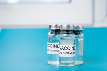 Coronavirus vaccine on the table in the hospital in ampoules, vaccination of people from covid-19 concept