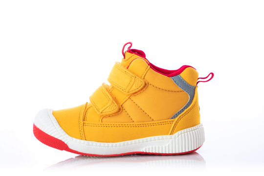Yellow Baby Shoes. Kids Sport Sneakers Isolated On White Background