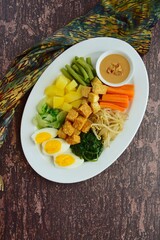 Traditional Indonesian Food, Gado-gado. Made from boiled vegetable, egg, tempeh and fried tofu served with peanut sauce