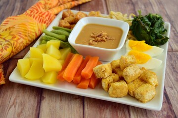 Traditional Indonesian Food, Gado-gado. Made from boiled vegetable, egg, tempeh and fried tofu served with peanut sauce