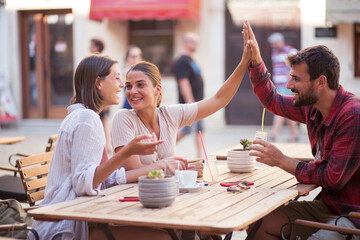 Friends have a talk on terrace