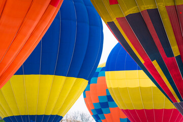 Closeup of colorful Hot Air Ballon flying in the sky. Concept of amazing travel, extreme sport,...