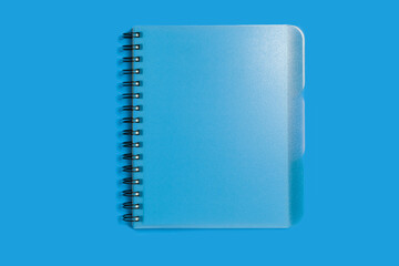 spiral notebook on a blue background