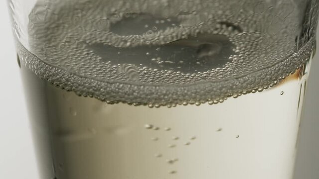 Champagne bubbles going up in super slow motion