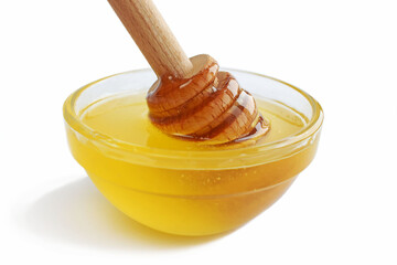 Fresh honey in a glass plate on a white background.