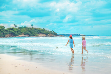 Child girl on the beach in ocean. Selective focus.