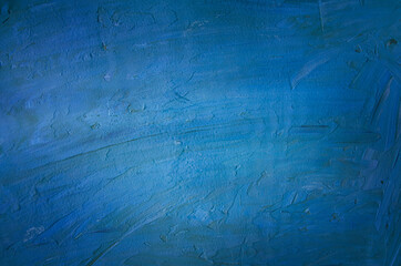 Blue background with darkened edges, under a concrete wall