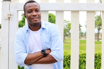 Happiness Africa young man smile portrait at garden.