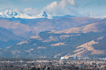 Panoramic view of the city of Huancayo at the foot of the imposing mountains and the snowy Huaytapallana. Huancayo - Peru