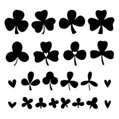 Fototapeta premium Set of clover or trefoil or shamrock leaves, St Patrick Day symbol. Silhouette vector illustrations isolated on the white background.