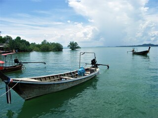 Fisher boat at the local harbor in South Thailand. Longtail boat is a traditional Thai boat. Province de Krabi. 