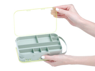 Organizer plastic box for screws in hand on white background isolation