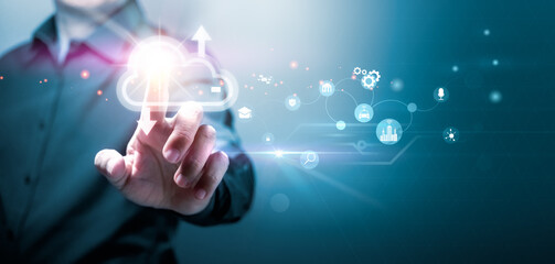 Businessman touching cloud networking of global data network with his finger. Social network of databases and big data