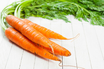 Carrot on white wooden table