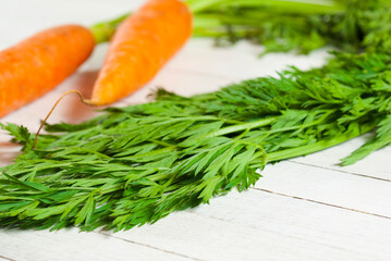 Carrot on white wooden table