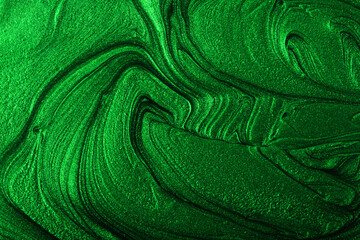 Beautiful emerald green stains of liquid nail polish,fluid art technique.Monochrome marble background.Liquid stripy paint texture.Nail lacquer flow modern backdrop. Minimalism concept.Copy space. - obrazy, fototapety, plakaty